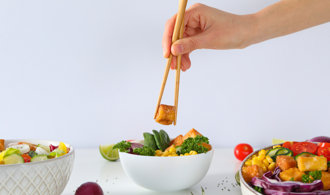 eating tofu with chopsticks